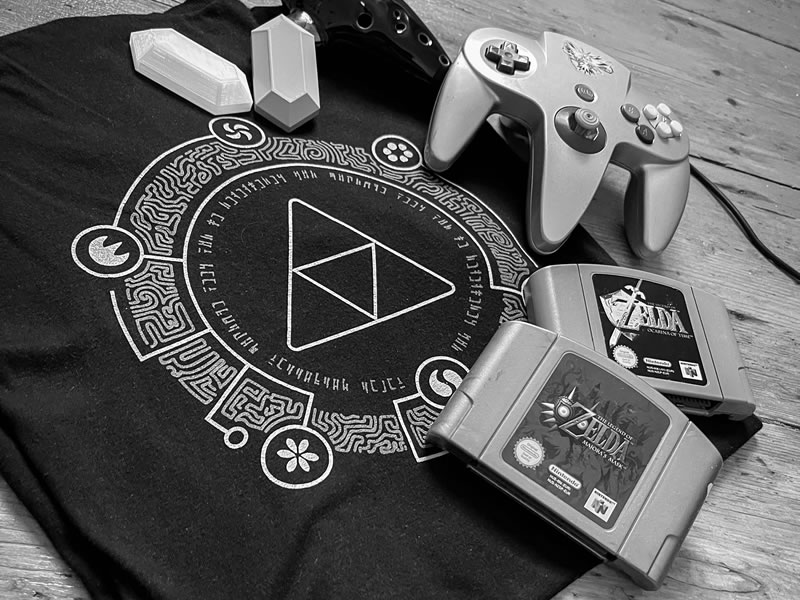 Image of a Zelda inspired Triforce t-shirt, and classic games