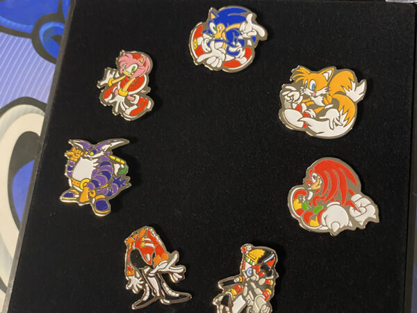 An image of classic Sonic pins from Sonic Adventure. Image depicts classic characters like Sonic, Tails, Knuckles and more 
