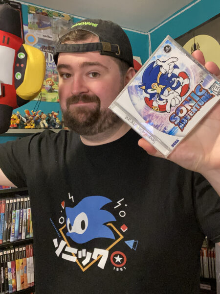 A photo of the streamer @collectionrevolution wearing a Sonic the Hedgehog shirt
