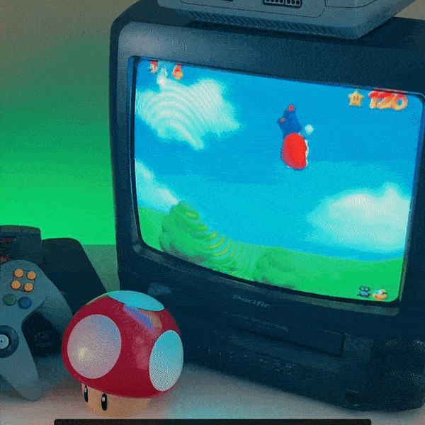 A gif image of Super Mario 64 on a CRT TV